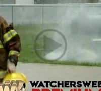 Firemen Struggle With Hose